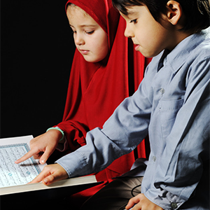 Boys reading Quran