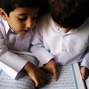 Children reading Quran together